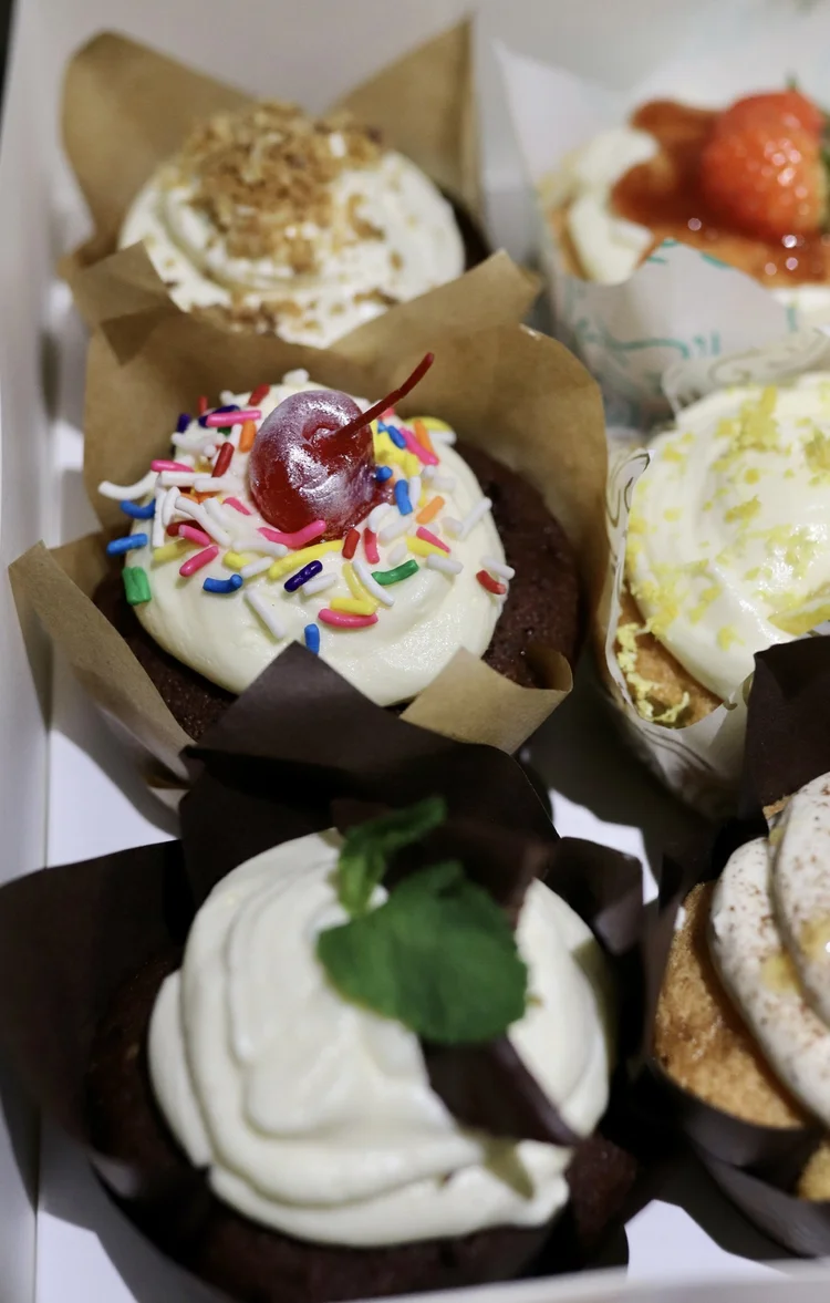 Assorted cupcakes with various toppings